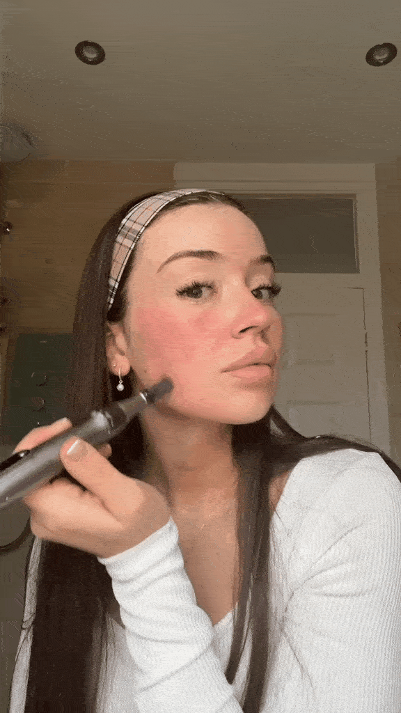 Beauty influencer using Dr. Pen M8s microneedling pen around eye area to reduce fine lines and signs of tiredness, as an affordable at-home alternative to Botox.